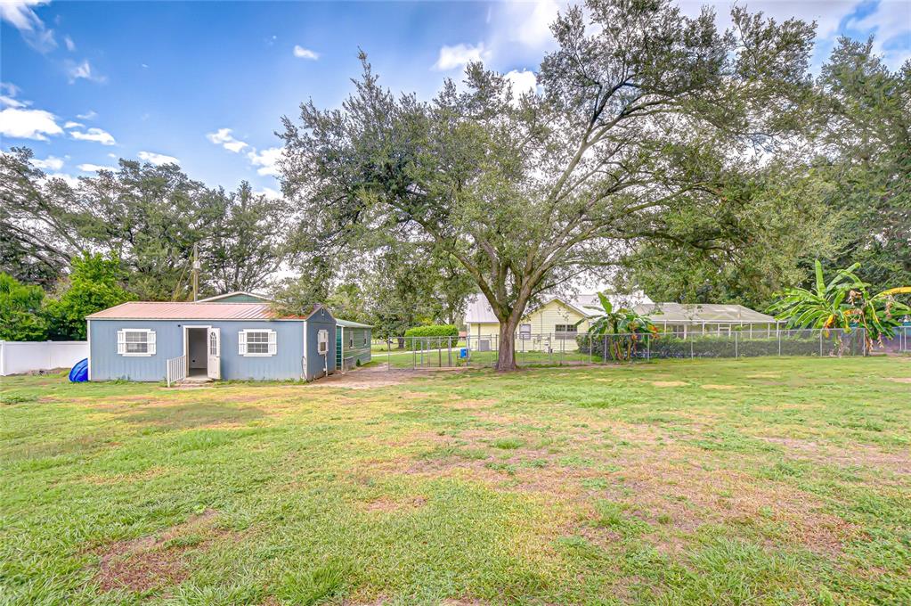 16349 Spring Valley Road Dade City, FL 33523 - Photo 7 of 40 a view of a house with a yard