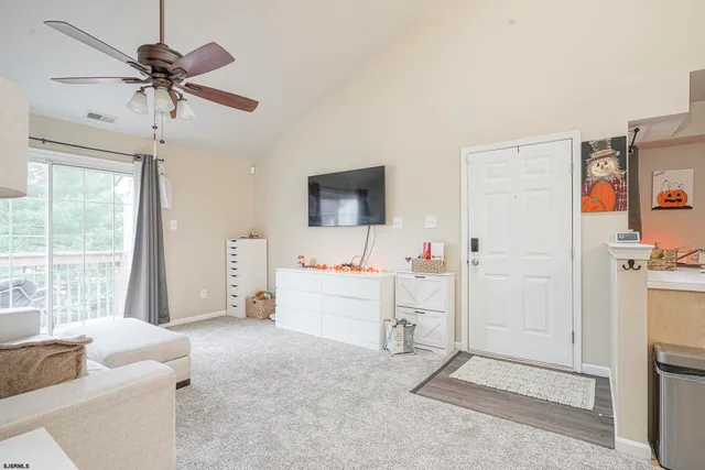 a view of livingroom with furniture and ceiling fan