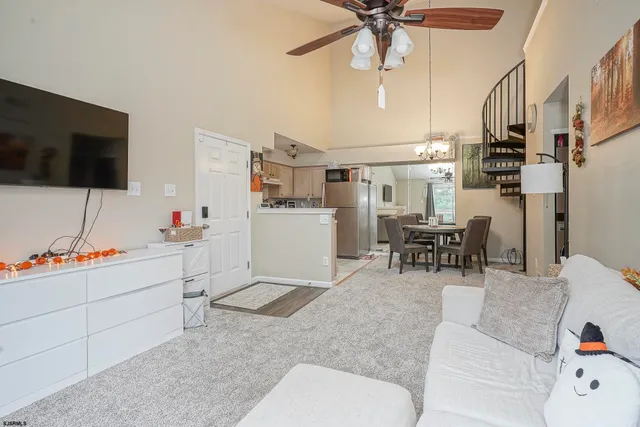 a work room with furniture and a flat screen tv