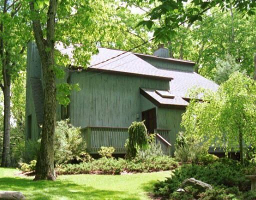 a backyard of a house with lots of green space