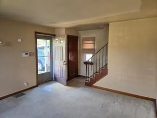 a view of a livingroom with a staircase