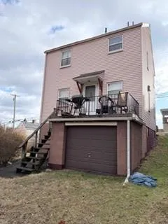 a view of kitchen with cabinets
