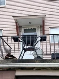 a view of staircase with white walls