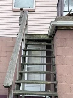a view of a building with wooden stairs