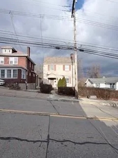 a view of a building with a street