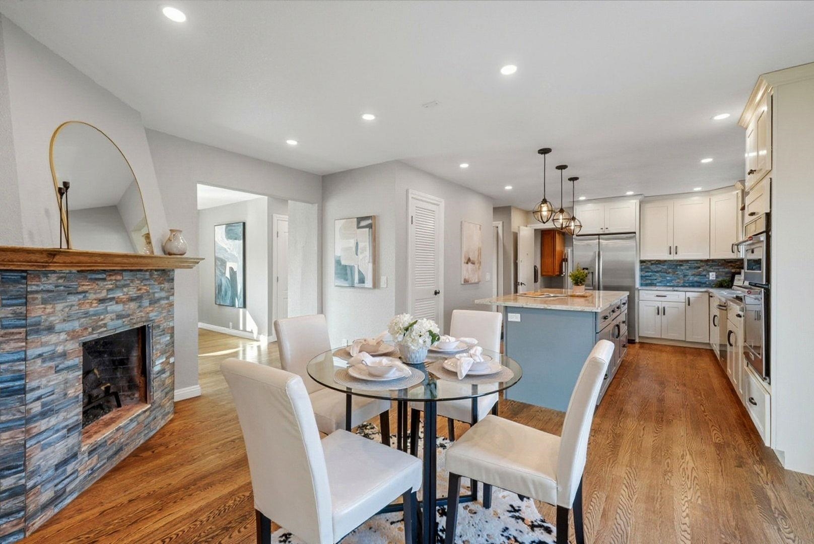 1368 Pegan Common Livermore, CA 94550 - Photo 12 of 47 a view of a dining room with furniture and a fireplace