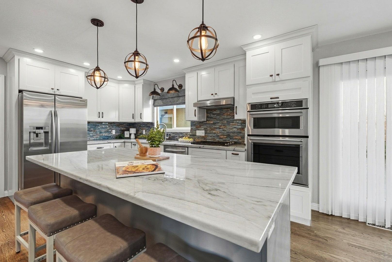 1368 Pegan Common Livermore, CA 94550 - Photo 15 of 47 a kitchen with a refrigerator a oven and chairs