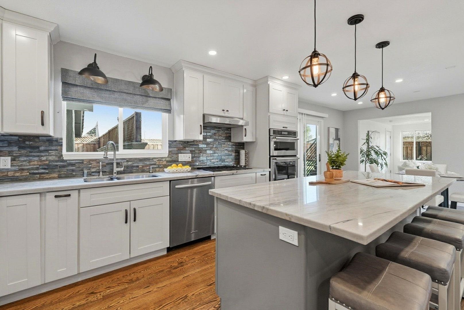 1368 Pegan Common Livermore, CA 94550 - Photo 16 of 47 a kitchen with a counter space a sink and appliances