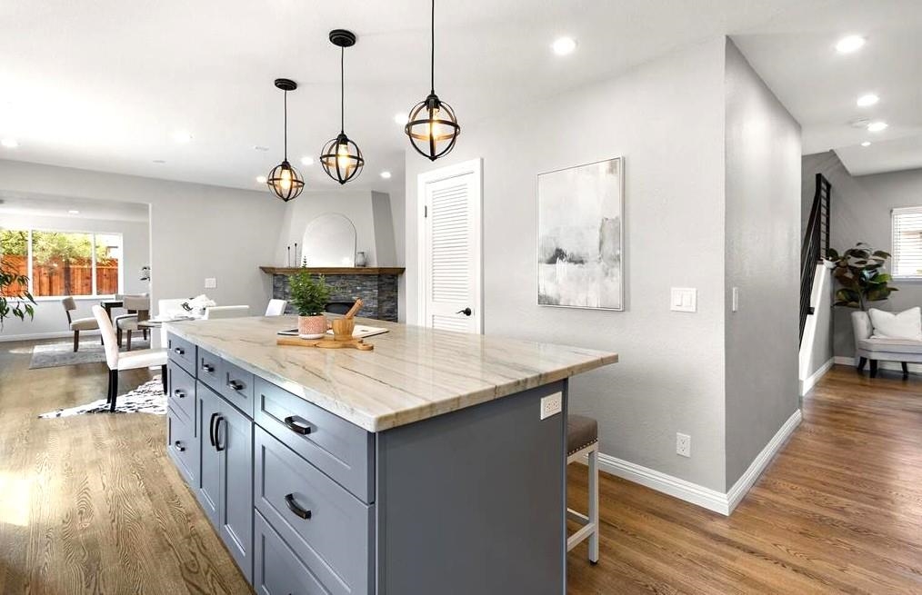 1368 Pegan Common Livermore, CA 94550 - Photo 17 of 47 a kitchen with a stove and wooden floor