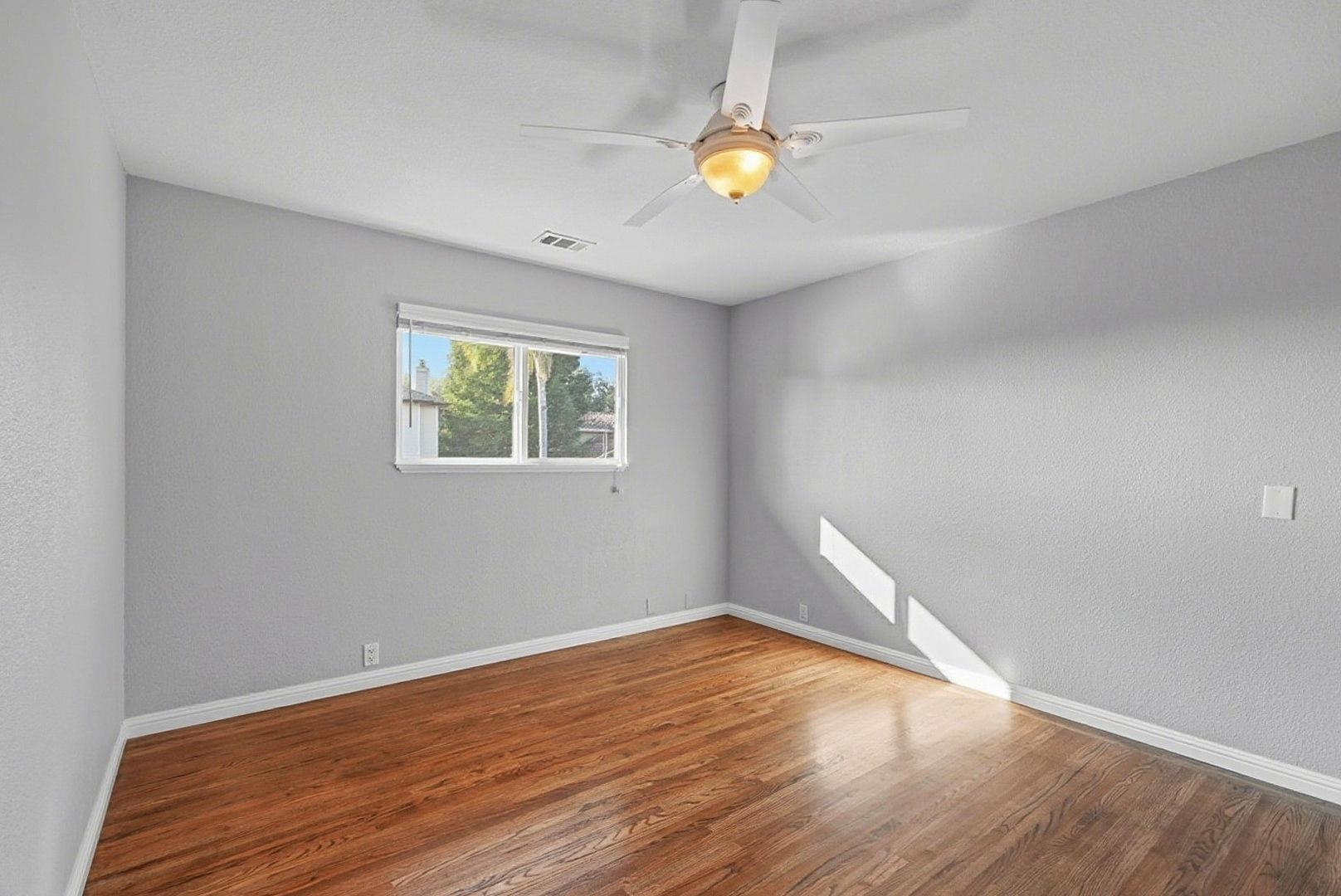 1368 Pegan Common Livermore, CA 94550 - Photo 27 of 47 a view of empty room with wooden floor