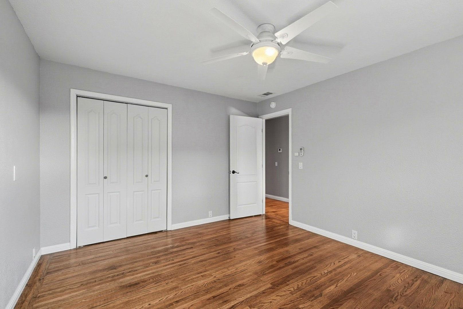 1368 Pegan Common Livermore, CA 94550 - Photo 28 of 47 a view of an empty room with wooden floor