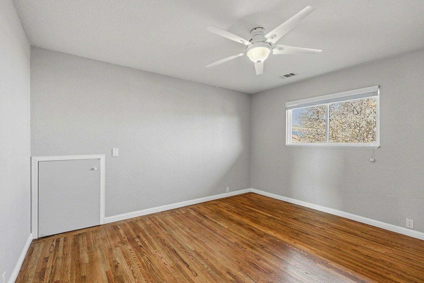 1368 Pegan Common Livermore, CA 94550 - Photo 30 of 47 a view of an empty room with wooden floor