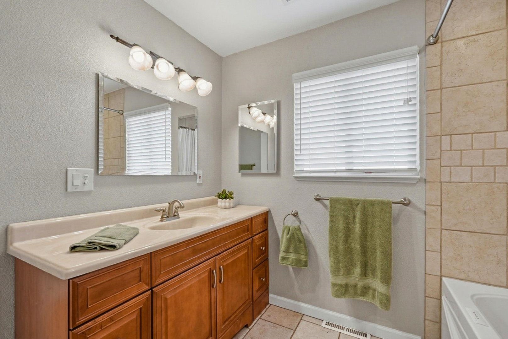 1368 Pegan Common Livermore, CA 94550 - Photo 31 of 47 a bathroom with a sink and a mirror