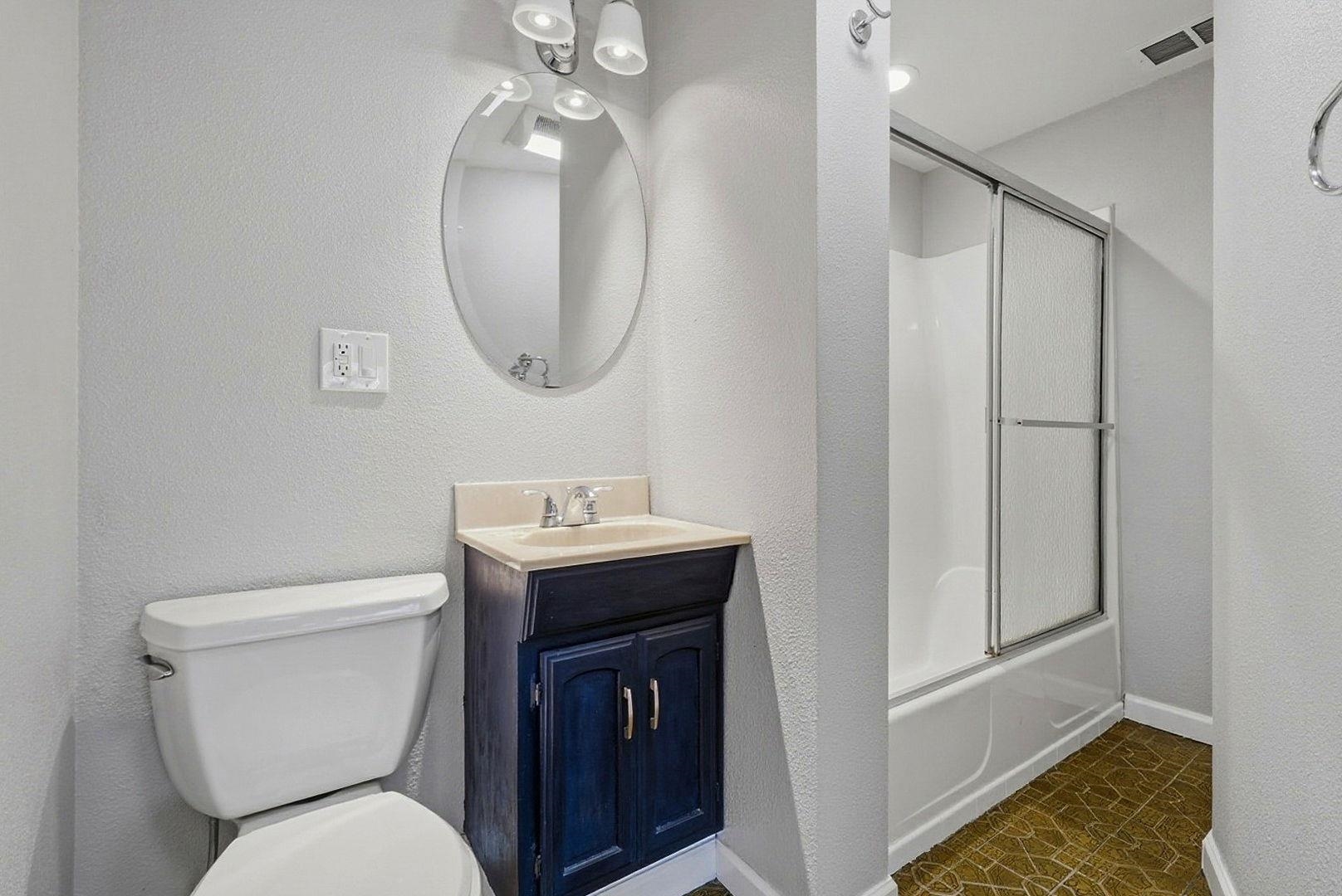 1368 Pegan Common Livermore, CA 94550 - Photo 37 of 47 a bathroom with a toilet sink and mirror