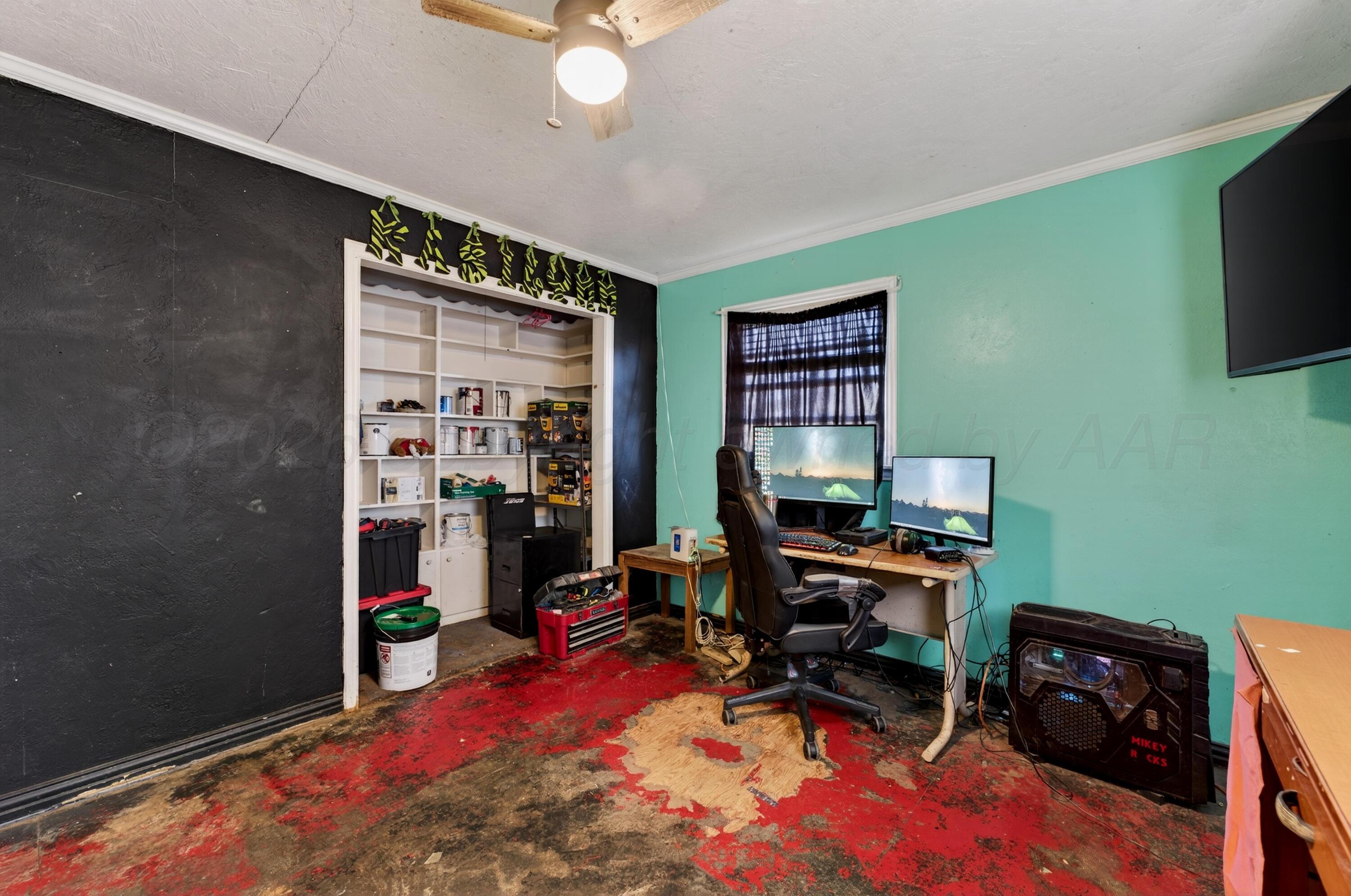 2519 9th Avenue Canyon, TX 79015 - Photo 17 of 24 a view of a workspace with furniture and a window