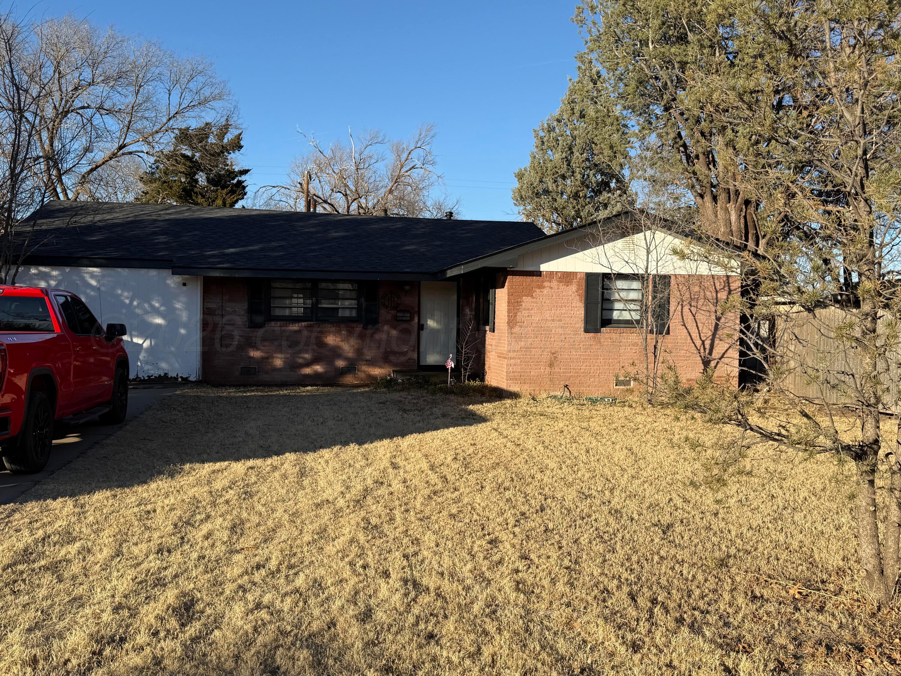 2519 9th Avenue Canyon, TX 79015 - Photo 2 of 24 a view of a house with a yard and garage