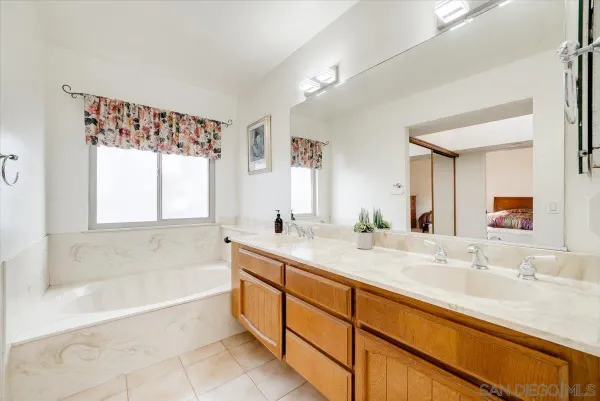 a view of a chairs and table in front of a door