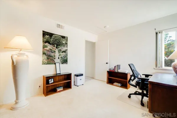 a view of a patio with table and chairs with wooden floor and fence
