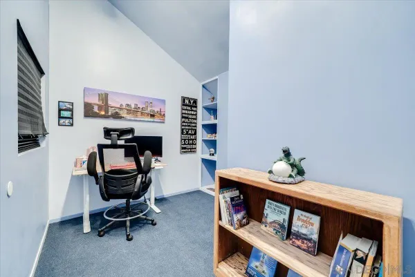 a view of a balcony with wooden floor and potted plants
