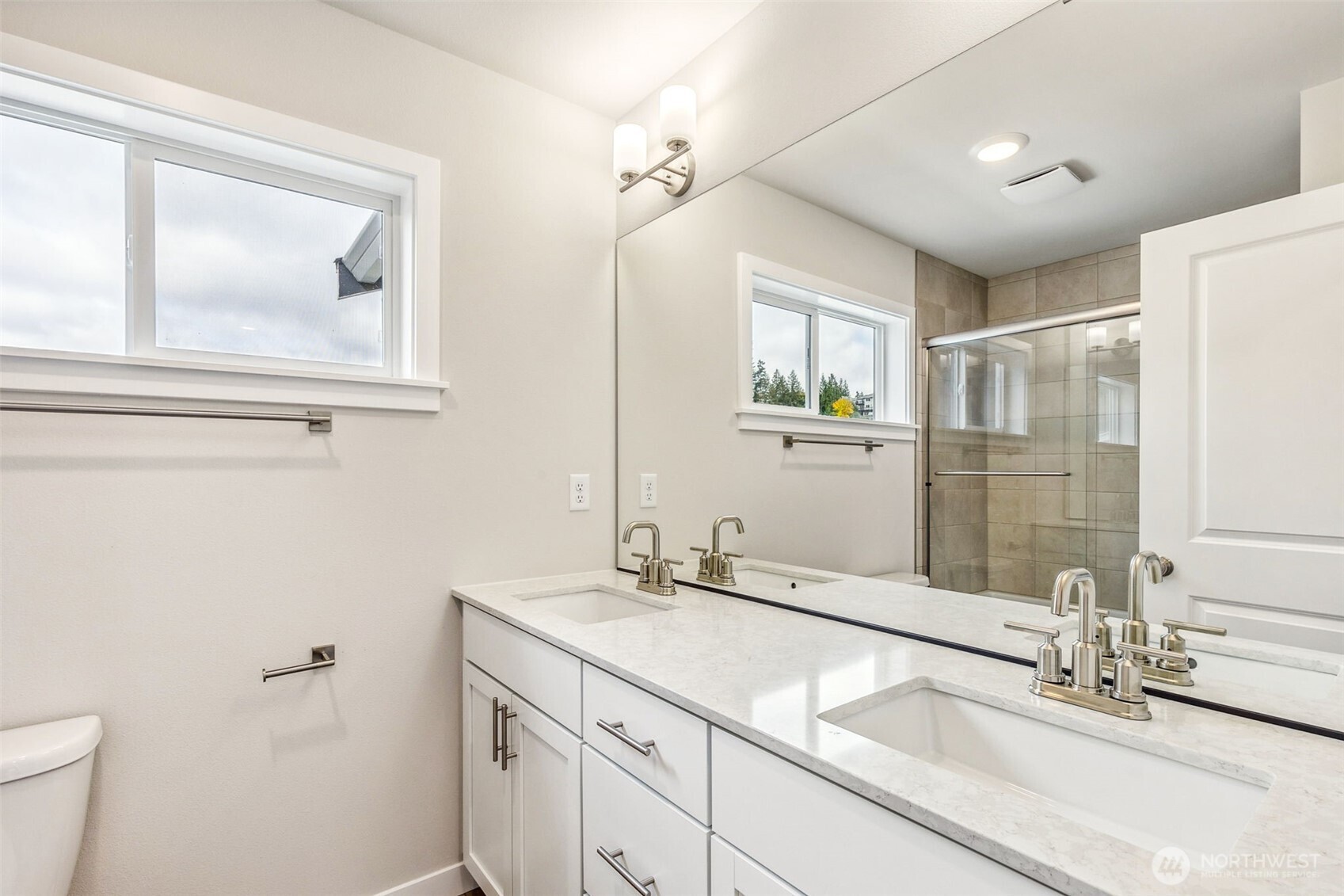 13406 323rd Drive Southeast Sultan, WA 98294 - Photo 16 of 29 a bathroom with a double vanity sink and a mirror