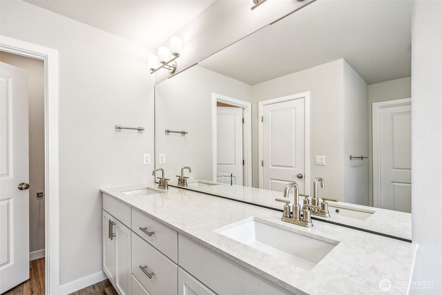 13406 323rd Drive Southeast Sultan, WA 98294 - Photo 27 of 29 a bathroom with a double vanity sink a mirror and a bathtub
