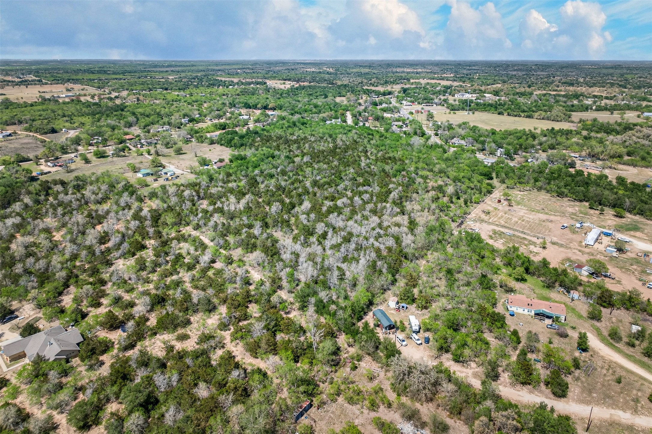 0 Fm 1854 Rd Dale Dale, TX 78616 - Photo 24 of 29 an aerial view of residential houses with outdoor space and trees
