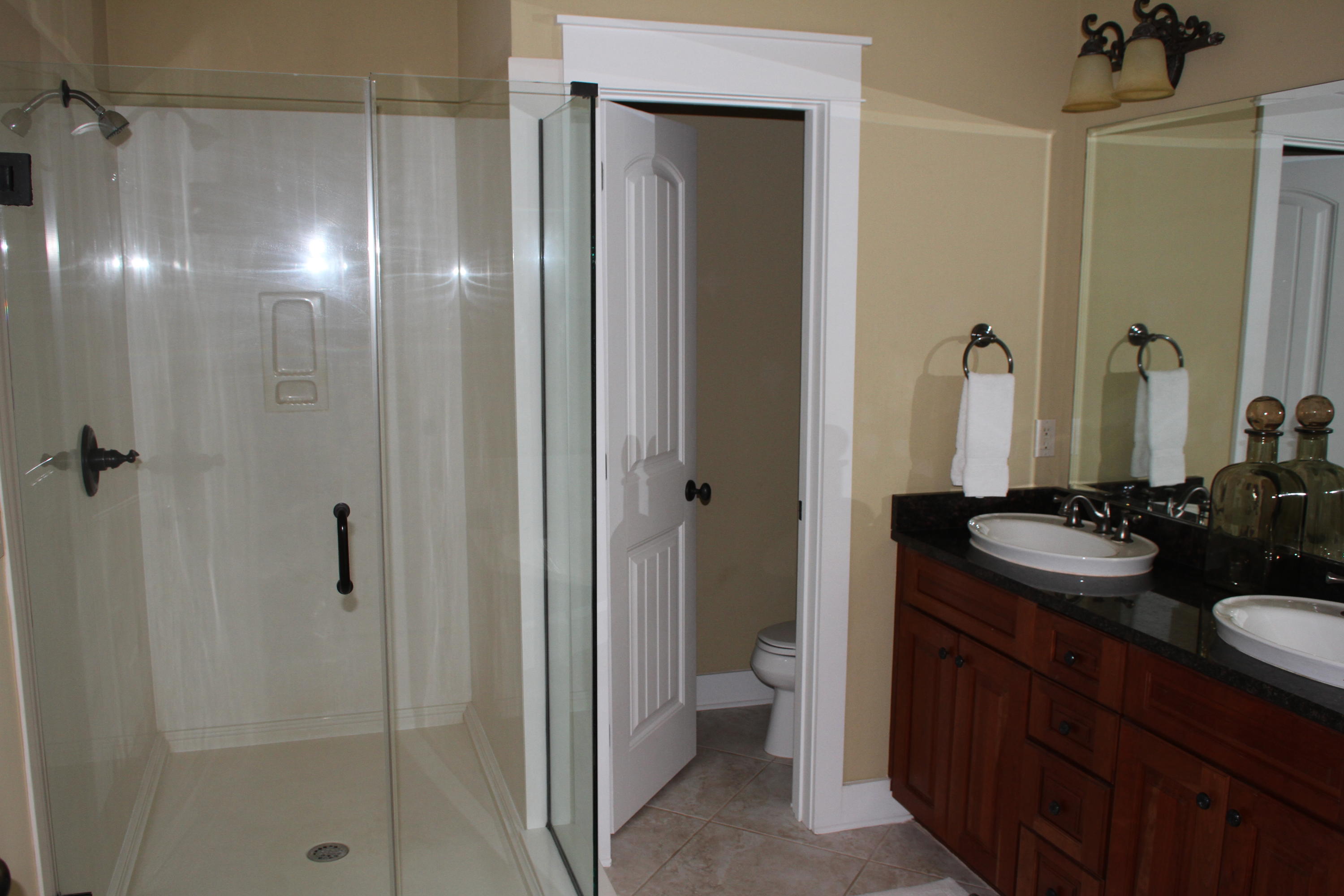 59 Willow Mist Road Inlet Beach, FL 32461 - Photo 11 of 22 a bathroom with a double vanity sink and mirror with shower