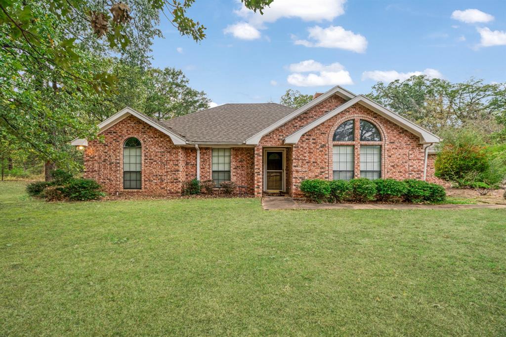 a front of a house with a garden