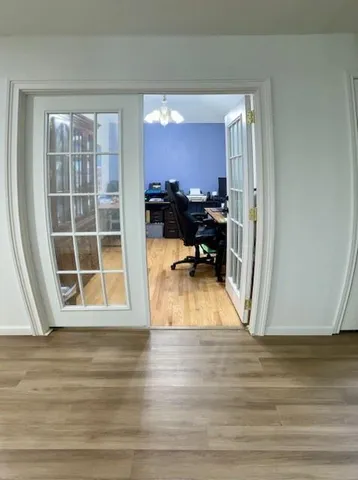 a view of a livingroom with furniture and front door