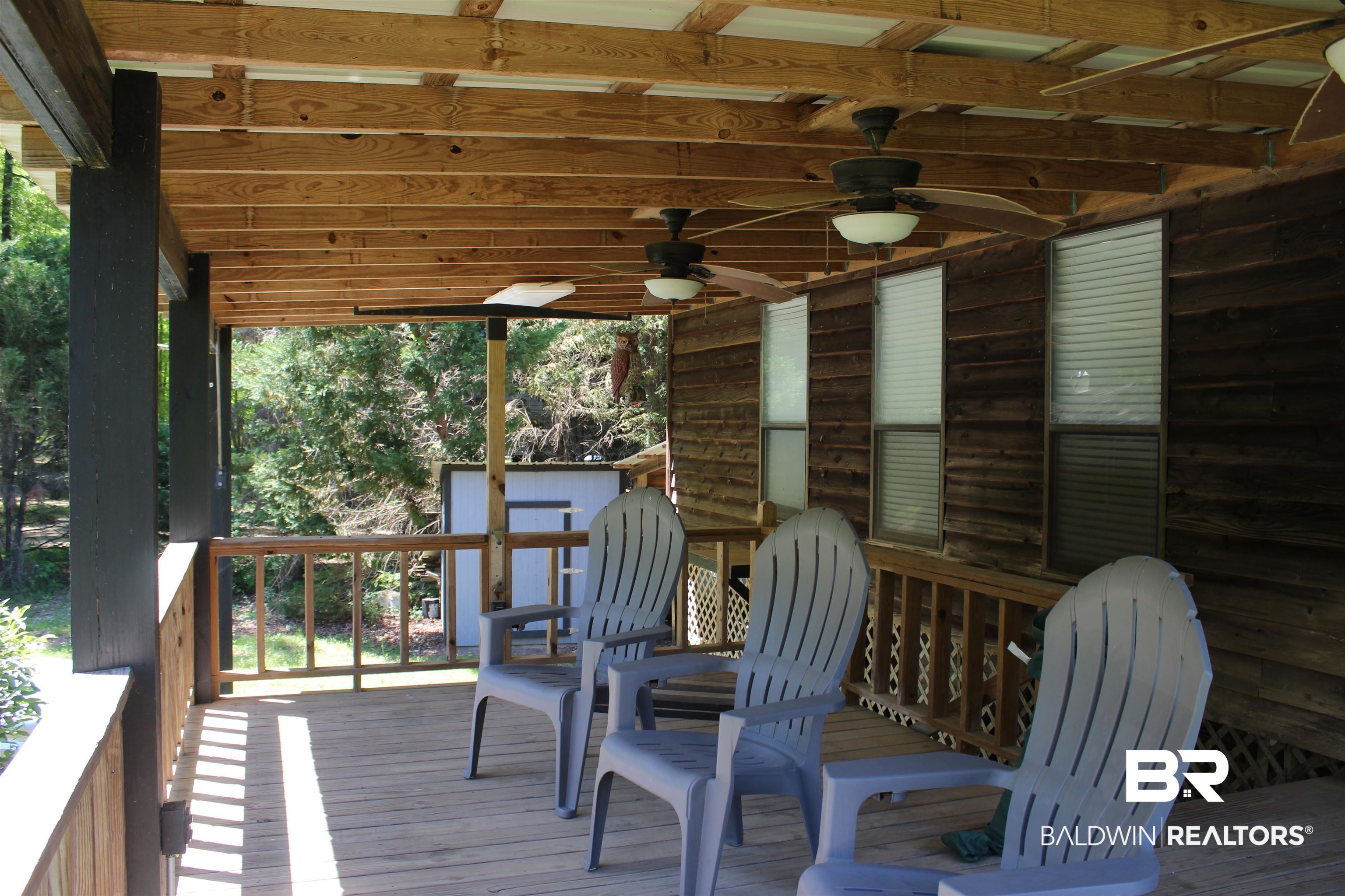 6447 Henderson Road Lowndesboro, AL 36752 - Photo 22 of 22 Wooden terrace with ceiling fan