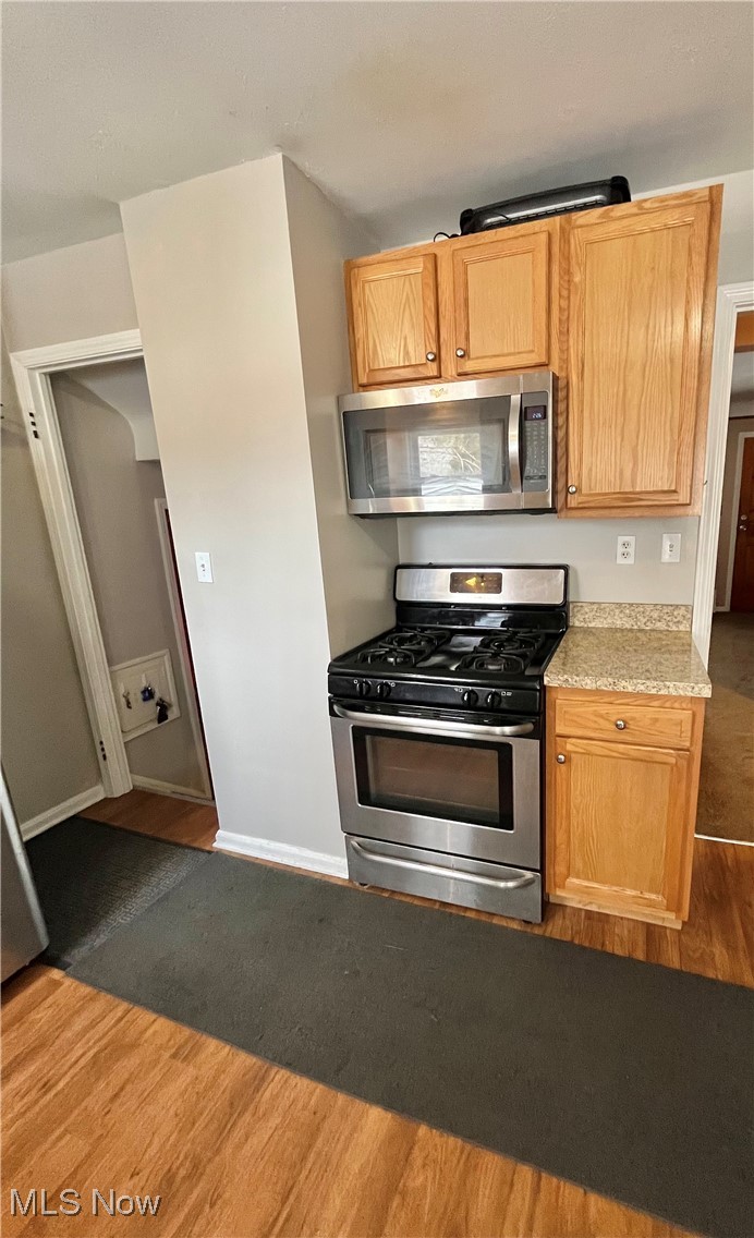 30009 Elgin Road Wickliffe, OH 44092 - Photo 25 of 44 Kitchen featuring wood-type flooring and appliances with stainless steel finishes