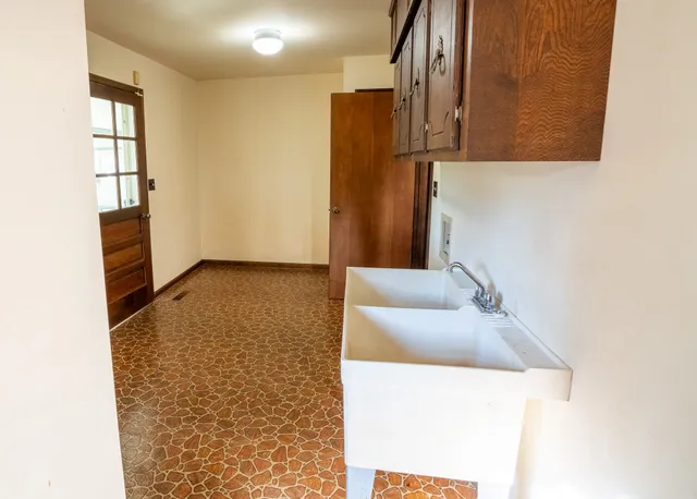 a view of kitchen with furniture and wooden floor