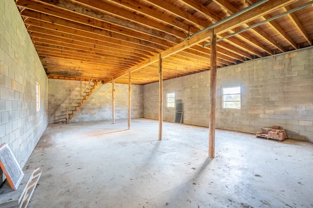 a green field with lots of trees in it