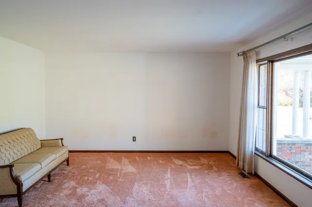 a view of an empty room and window