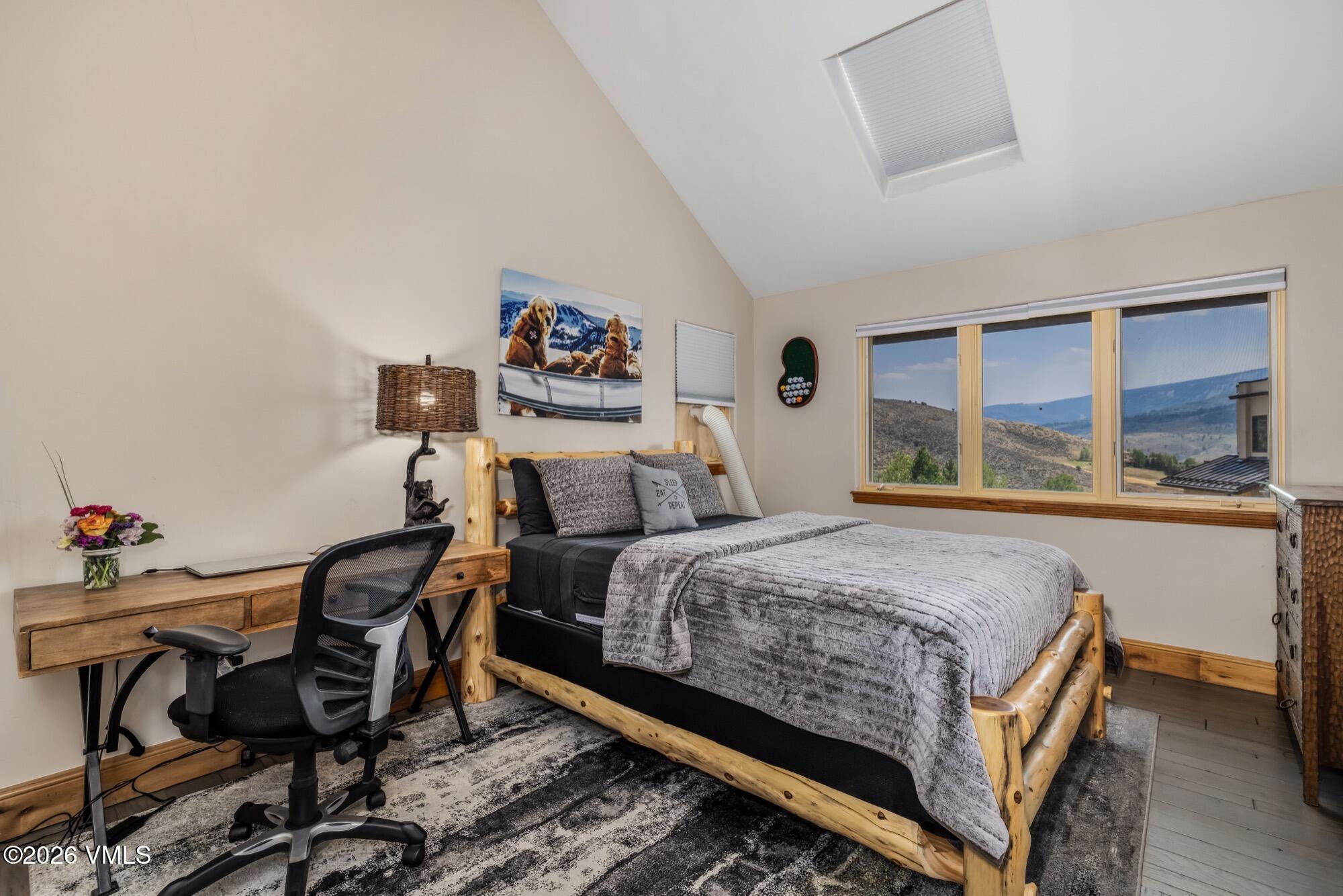 1671 Winslow Road Edwards, CO 81632 - Photo 32 of 48 a bedroom with a bed and a table in it