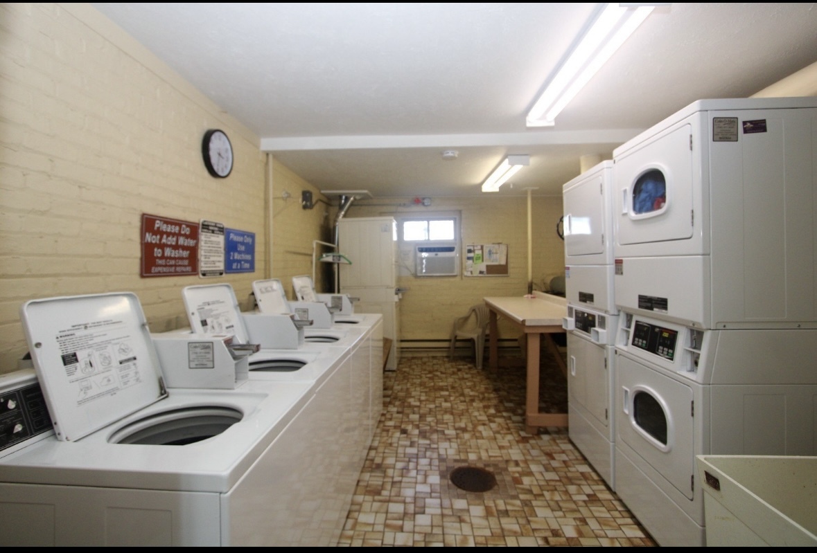 222 Madison Street, Unit 208 Joliet, IL 60435 - Photo 20 of 20 a living room with furniture and wooden floor
