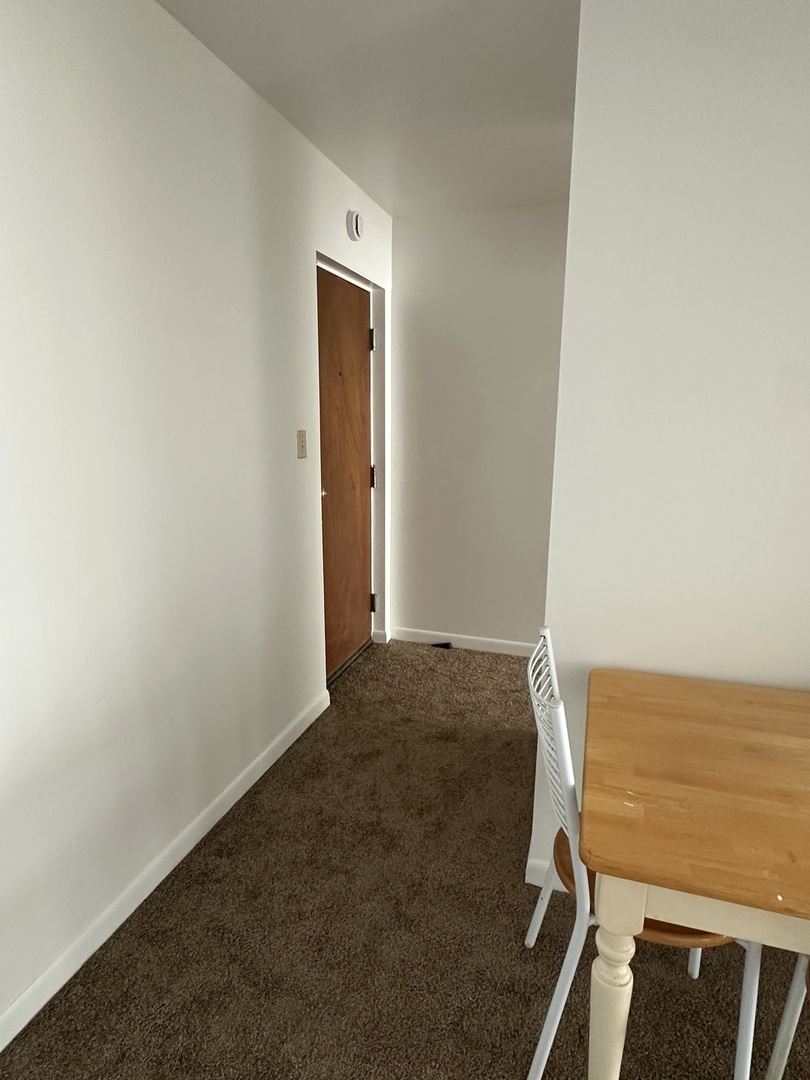 222 Madison Street, Unit 208 Joliet, IL 60435 - Photo 6 of 20 a view of a room with an empty space