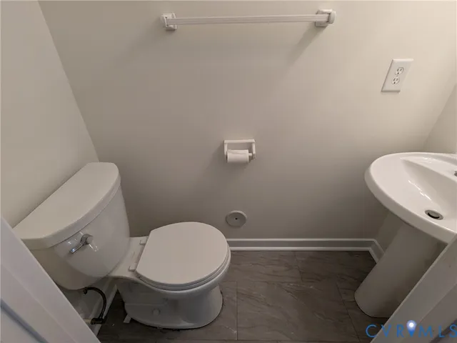 a bathroom with a toilet and a sink