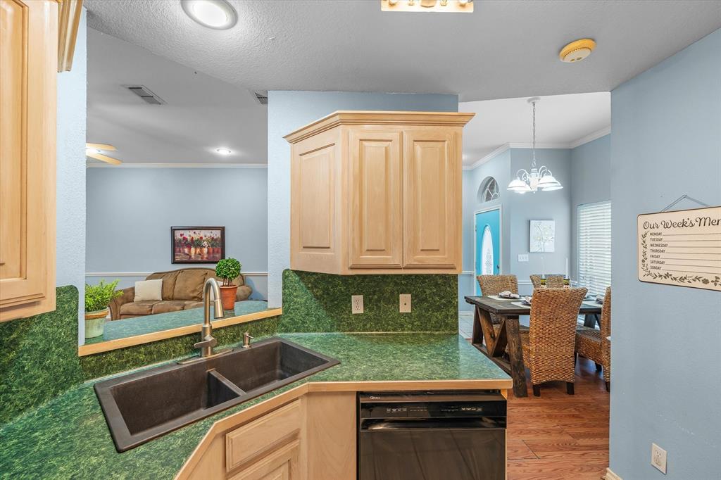 560 Washington Street Van, TX 75790 - Photo 15 of 29 a kitchen that has a sink and a stove with granite countertops