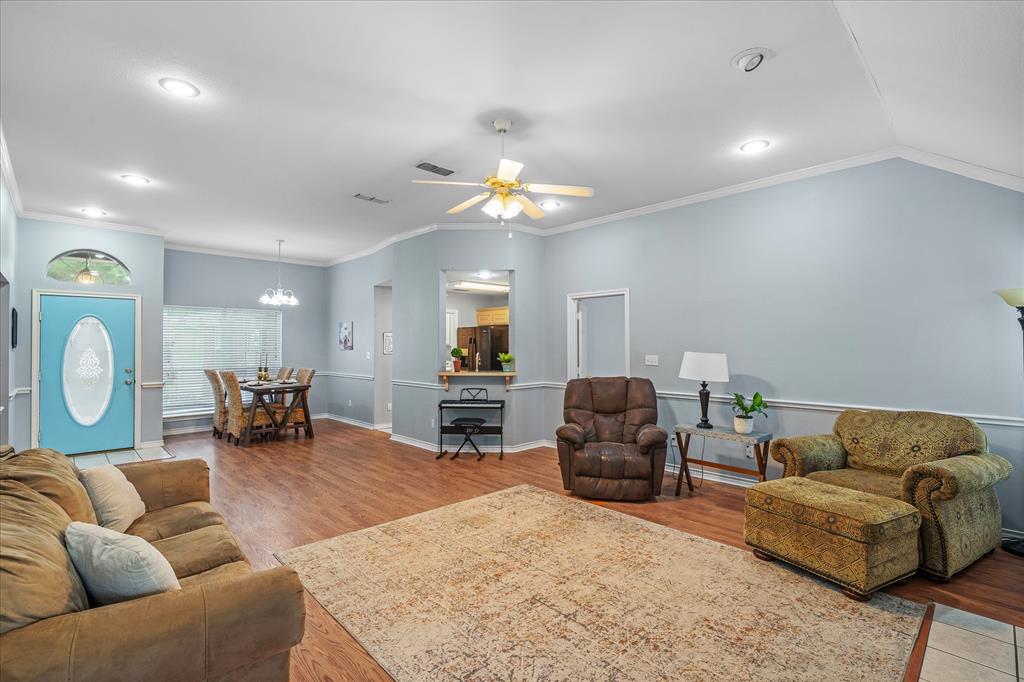 560 Washington Street Van, TX 75790 - Photo 18 of 29 a living room with furniture a couch and a chandelier