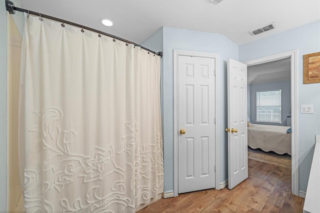 560 Washington Street Van, TX 75790 - Photo 23 of 29 a view of a bathroom with a shower curtain