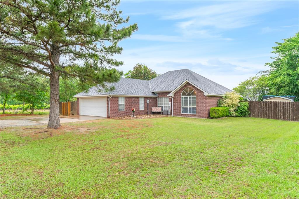 560 Washington Street Van, TX 75790 - Photo 4 of 29 a front view of a house with yard and green space