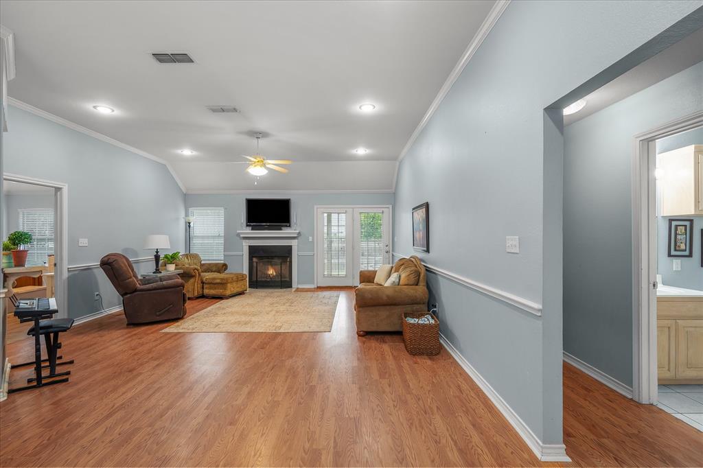 560 Washington Street Van, TX 75790 - Photo 6 of 29 a living room with furniture hard wood floor and a fireplace