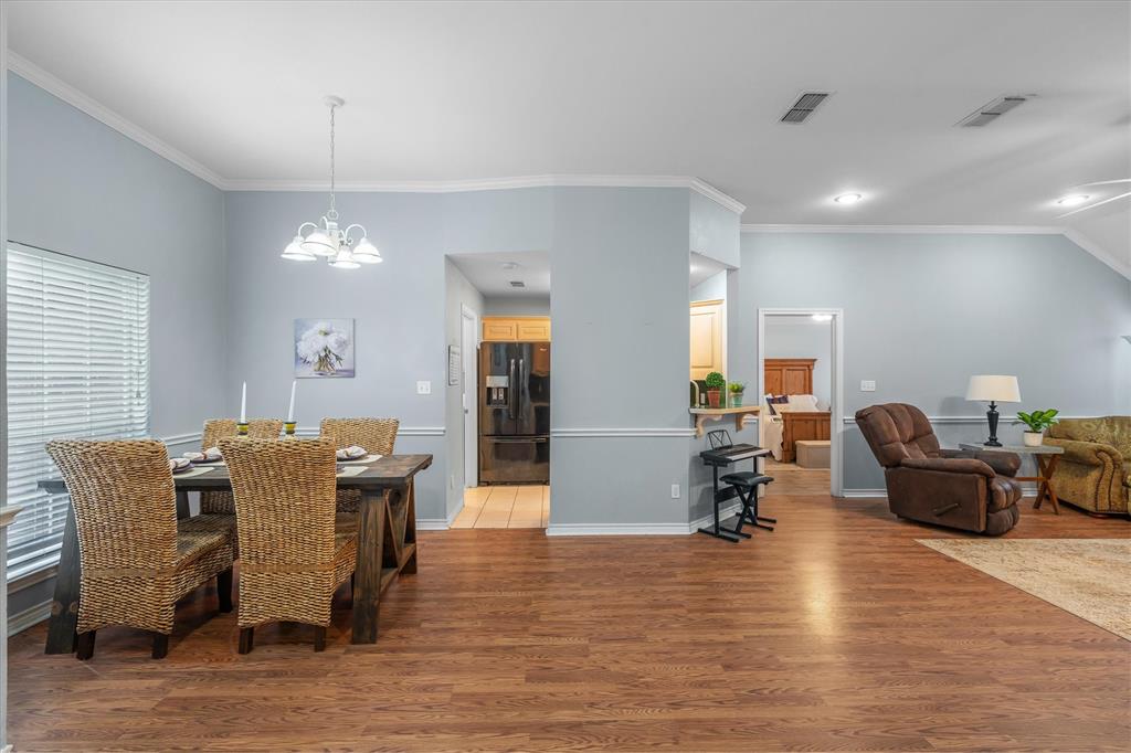 560 Washington Street Van, TX 75790 - Photo 7 of 29 a dining room with furniture a chandelier and wooden floor