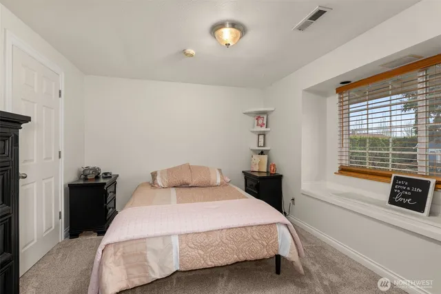 a bedroom with a bed and furniture