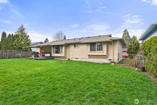 a view of a house with a back yard