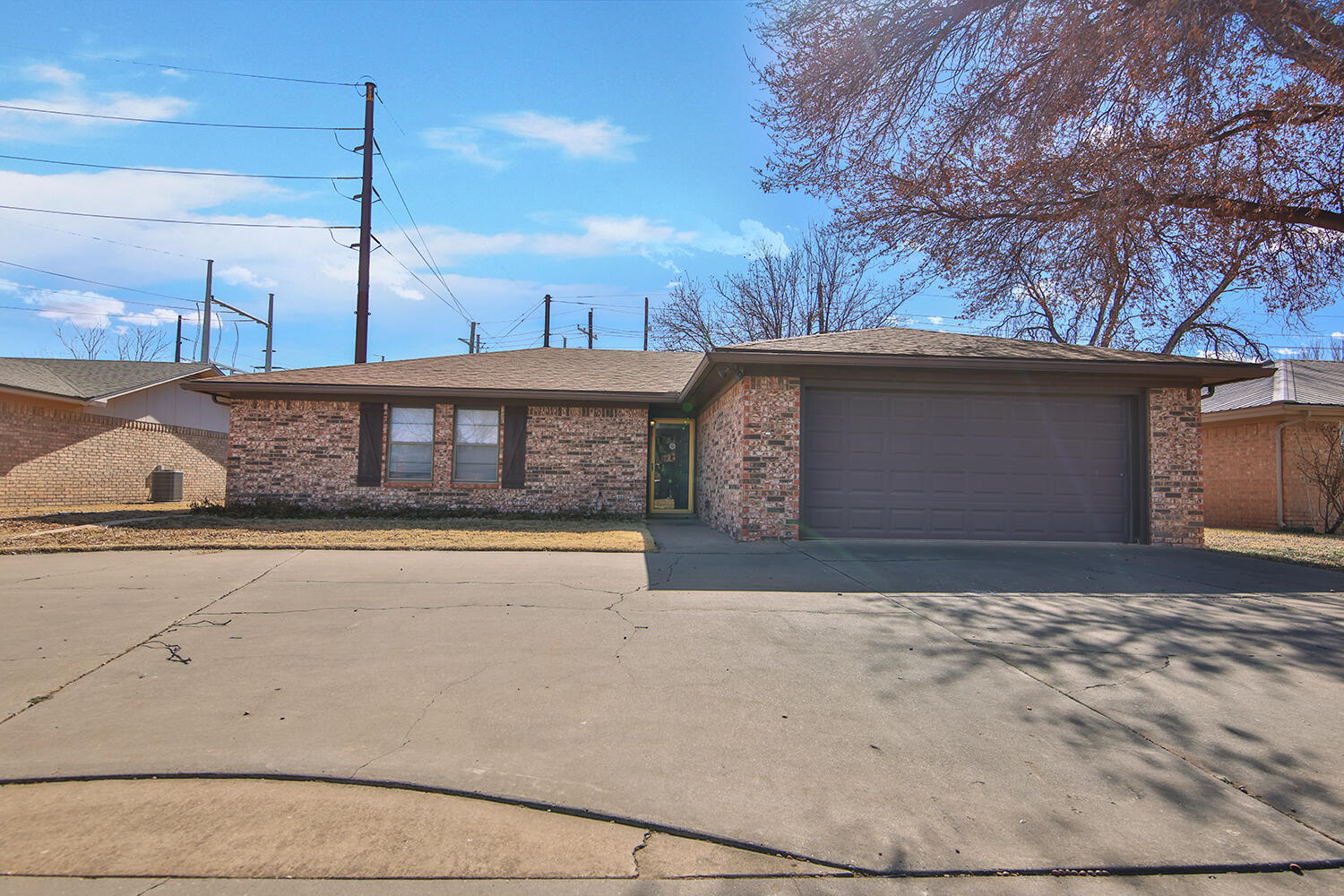 4805 73rd Street Lubbock, TX 79424 - Photo 2 of 26 a front view of a house with a yard