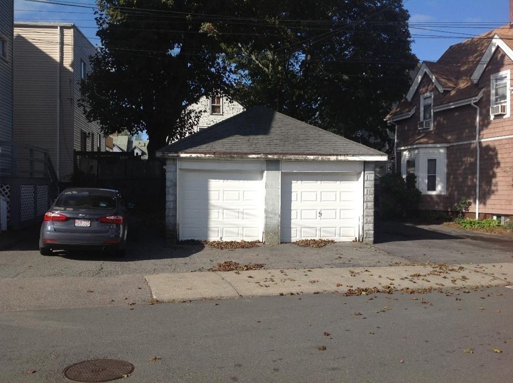 29 Lewis Street, Unit 2 Lynn, MA 01902 - Photo 19 of 22 a car parked in front of a house