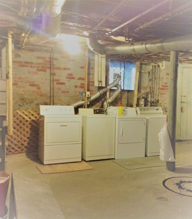 29 Lewis Street, Unit 2 Lynn, MA 01902 - Photo 21 of 22 a utility room with washer and dryer