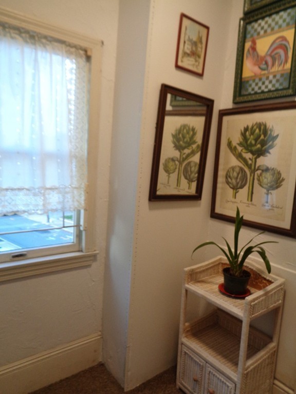 29 Lewis Street, Unit 2 Lynn, MA 01902 - Photo 4 of 22 a view of a door and a painting on the wall